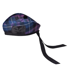 May include: A blue, purple and black tartan beret with a black bow and a black tassel. The beret has a black ribbon tied around it.
