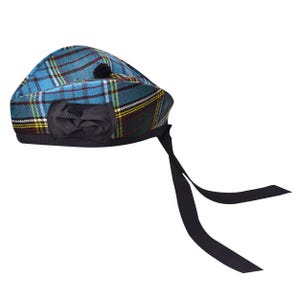 May include: A blue tartan beret with a black bow and ribbon ties. The beret has a plaid pattern in blue, green, yellow, and red. A small black pom-pom is on top. The ribbon ties are long.