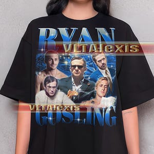 May include: Black t-shirt featuring a graphic of Ryan Gosling with the text "RYAN GOSLING" in a blue and white gradient font. The graphic includes multiple images of the actor. The shirt is a casual, oversized style.