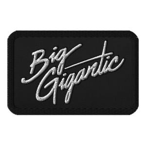 May include: Black embroidered patch with white lettering that reads "Big Gigantic".