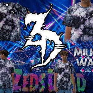 May include: Black and white tie-dye t-shirts featuring the number "3" on the chest. The shirts are shown against a blue backdrop with the words "Milky Way" and "Zedstad".