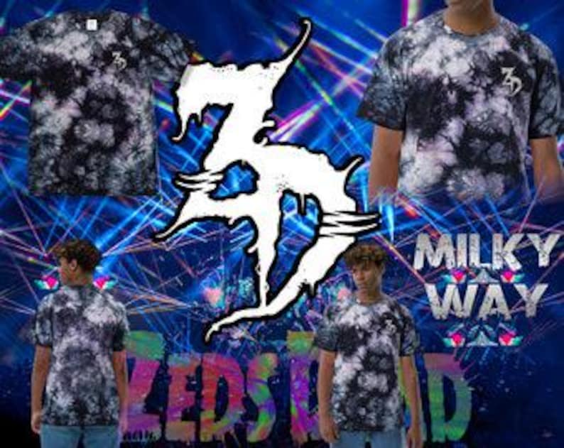 May include: Black and white tie-dye t-shirts featuring the number "3" on the chest. The shirts are shown against a blue backdrop with the words "Milky Way" and "Zedstad".