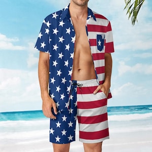 May include: A matching two-piece set featuring a button-down shirt and shorts. The shirt and shorts are split vertically, with one side displaying a blue background with white stars and the other side showcasing red and white stripes. The shorts have a drawstring.