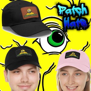 May include: Black baseball cap with a brown patch featuring a yellow cartoon character and the text "SUBTRONICS". The image also shows a pink cap with a similar design and the text "EDINOTAVE". The background is yellow with a large eye graphic.