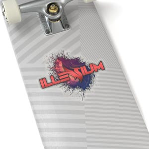 May include: A sticker with the word "ILLENIUM" in red and purple, with a stylized design. The sticker is on a skateboard deck with a gray and white striped pattern. The skateboard's metal trucks and wheels are visible.