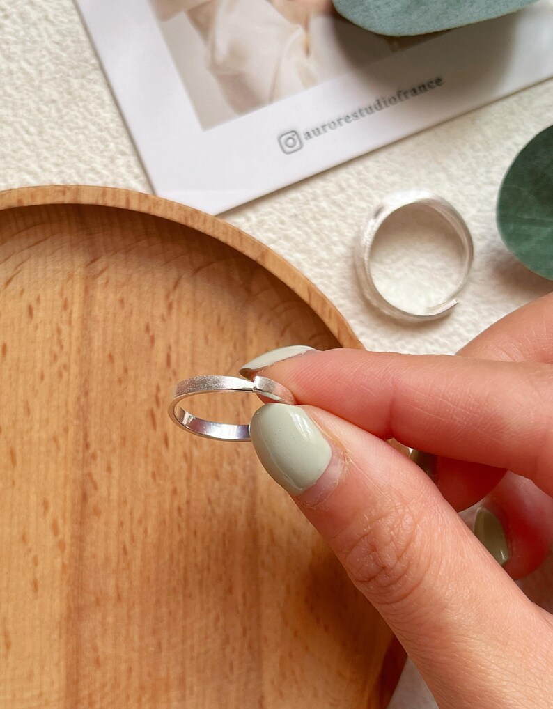 May include: Two silver rings with a hammered finish. The rings are simple and elegant, and would make a great gift for a friend or loved one.