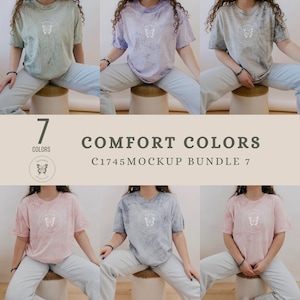 Puede incluir: Siete camisetas de diferentes colores con un gráfico de mariposa y el texto "COMFORT COLORS C1745 MOCKUP BUNDLE 7" sobre un fondo blanco.