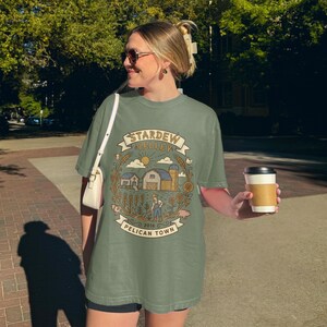 Stardew Valley Pelican Town Farm Life Design, Farmer Video Game Graphic, Cozy Gaming Merch, Farm Simulator Art, Game Lover Gift
Stardew