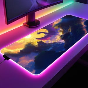 a computer desk with a computer monitor and a mouse pad