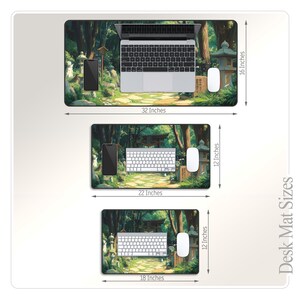 a computer mouse pad with a forest scene on it
