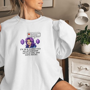 I'm in a committed relationship with a girl who eats rocks, fun novelty graphic sweatshirt, unique gift for gamers