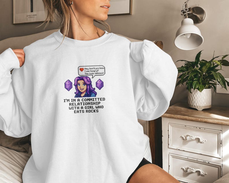 I'm in a committed relationship with a girl who eats rocks, fun novelty graphic sweatshirt, unique gift for gamers