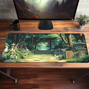 a computer monitor sitting on top of a wooden desk