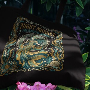 Black tote bag with "Night Market Mermaid Show" art nouveau design.