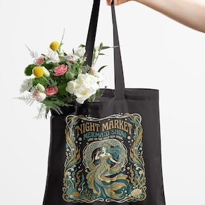 Tote bag with "Night Market Mermaid Show" design featuring a mermaid.