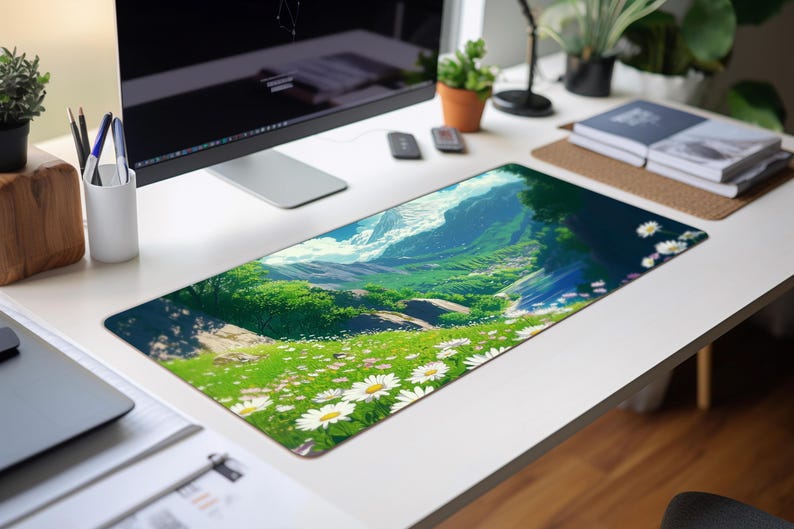 a computer desk with a computer monitor and a mouse pad