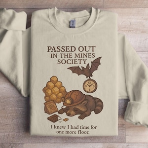 Passed Out in the Mines Society Sweatshirt Funny Raccoon Bat Clock Graphic, Quirky Gamer Sweatshirt, Tired Raccoon Lover Gift, Sleepy
