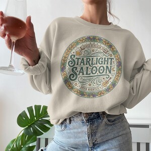 Starlight Saloon Sweatshirt, Vintage Graphic Pullover, Cozy Unisex Apparel, Retro Style Sweatshirt, Casual Outfit, Gift for Friends