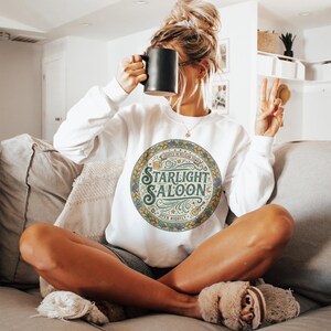 Cozy Starlight Saloon Sweatshirt, Retro Graphic Pullover, Vintage Style Lounge Wear, Warm and Comfy Casual Top, Unique Gift Idea