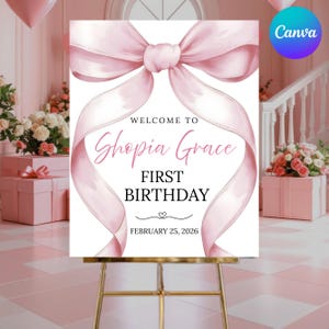 May include: A pink and white welcome sign for a first birthday. The sign features a large pink bow at the top, with the words "Welcome to Shopia Grace First Birthday" in pink script. The date February 25, 2026 is also included.