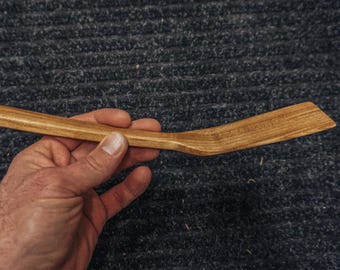 Small handmade spalted wood spatula with narrow paddle head in honey and brown tones