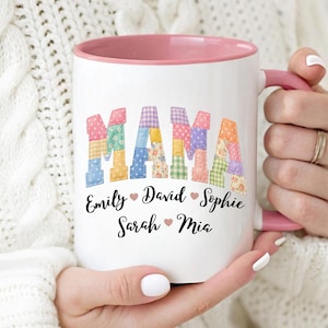 May include: White ceramic mug with a pink interior and handle. The word "MAMA" is displayed in colorful patchwork letters. Below the word are the names "Emily", "David", "Sophie", "Sarah", and "Mia".