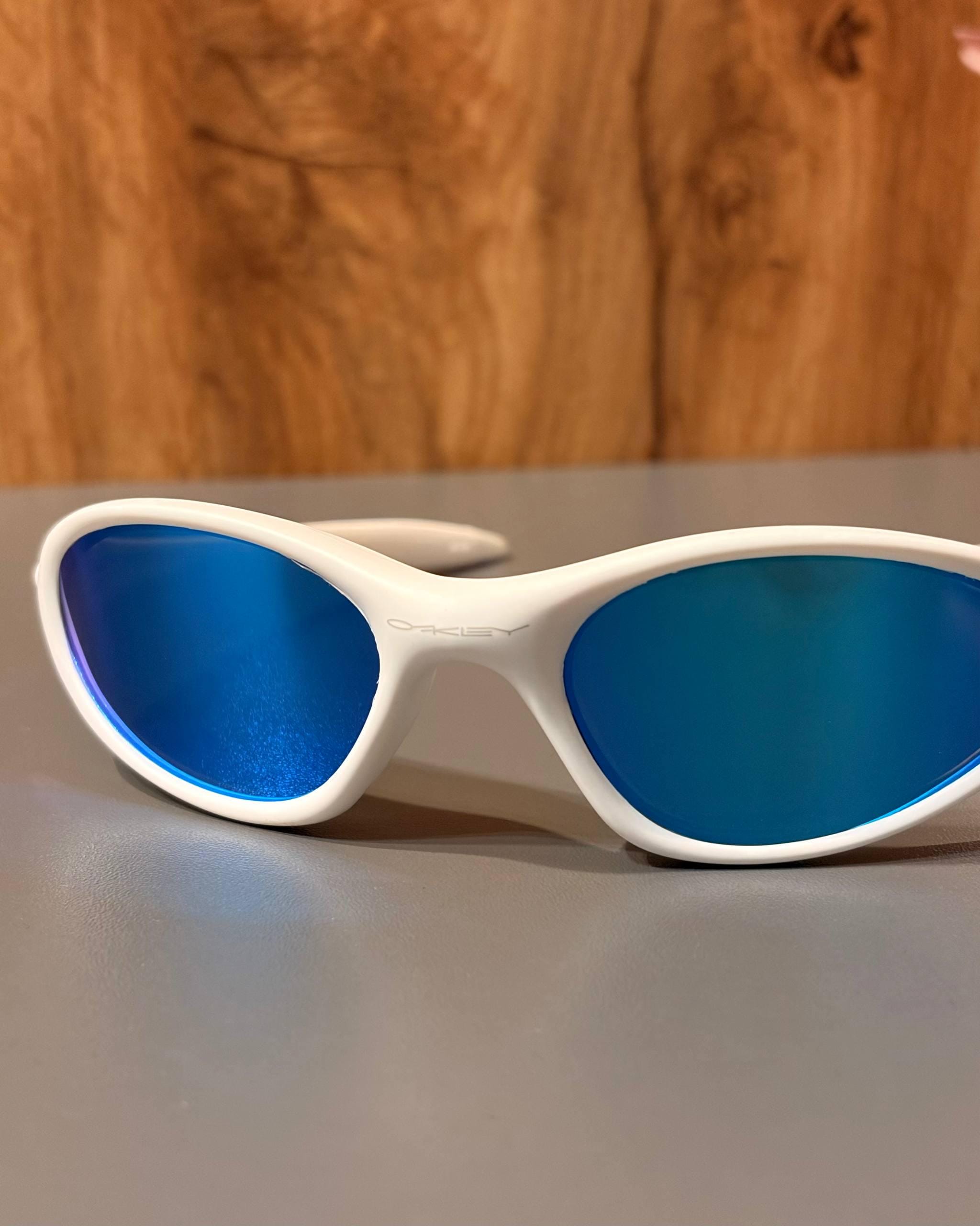 Oakley Minute 1.0: White Wrap Sunglasses W/ Blue Iridium Lens