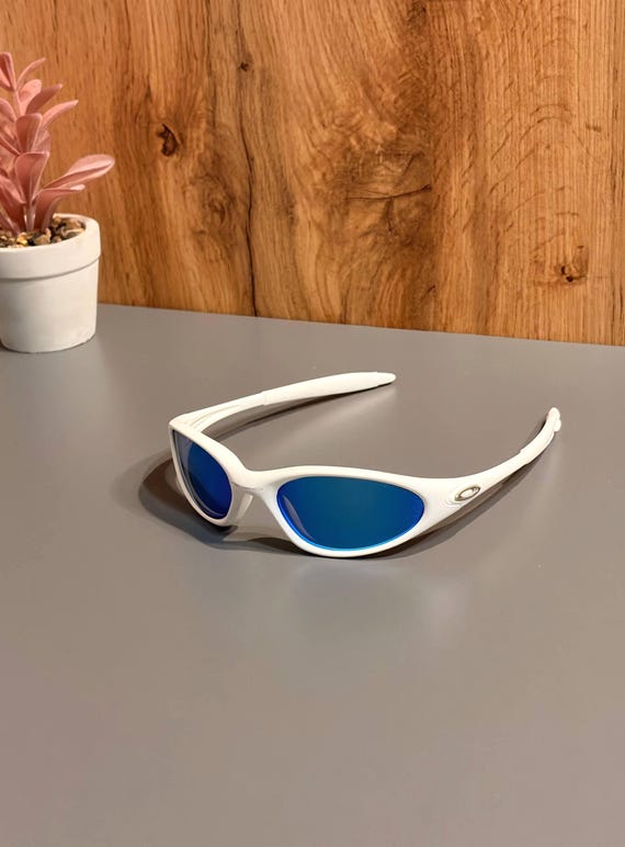 Oakley Minute 1.0: White Wrap Sunglasses W/ Blue Iridium Lens