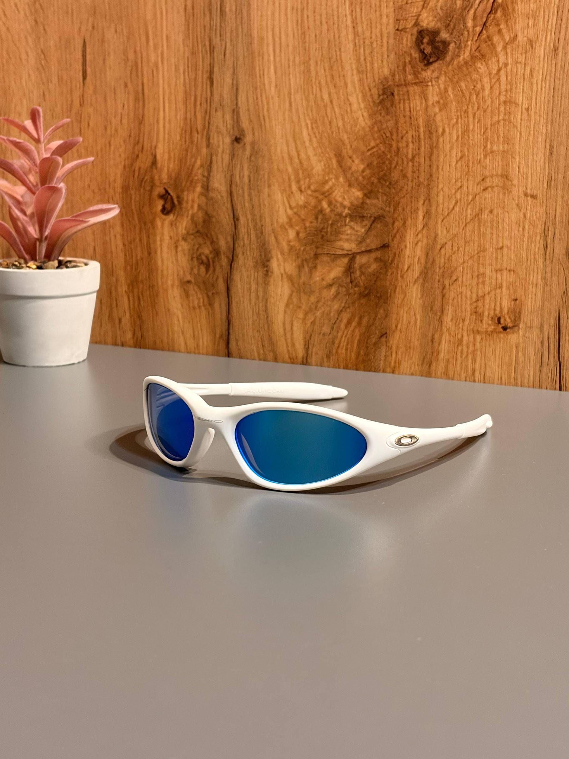 Oakley Minute 1.0: White Wrap Sunglasses W/ Blue Iridium Lens