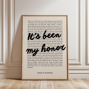 May include: A framed print with a beige background featuring printed text from a book. The words "It's been my honor" are written in a bold, black script across the center of the page. The frame is a warm, light brown color.