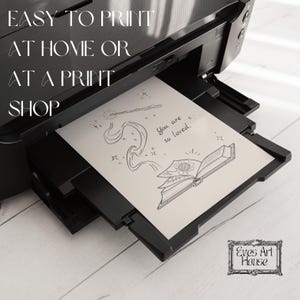 May include: A black and white printer is shown with a printed sheet of paper. The paper has a line drawing of a book, a wand, and the words "You are so loved." The text "EASY TO PRINT AT HOME OR AT A PRINT SHOP" is also visible.
