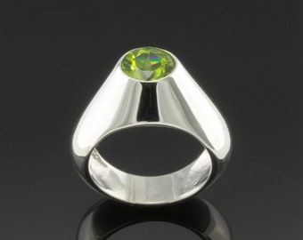 Sterling Silver Ring set with 7mm round facet cut Peridot.