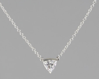 0.19 carat  Trillion Diamond set in 18 kt white gold pendant with chain attached.