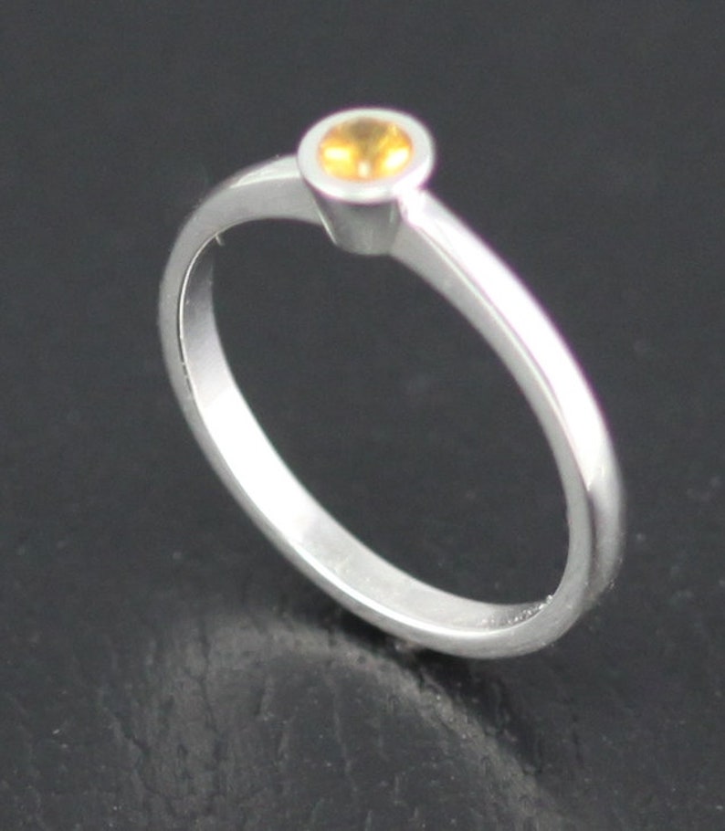 Non tarnish silver ring set with 3 mm round Citrine. Etsy
