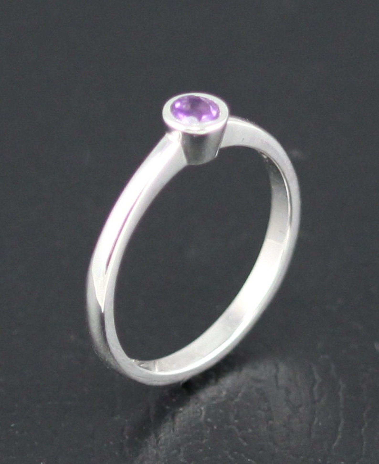 Non tarnish silver ring set with 3 mm round amethyst. Etsy