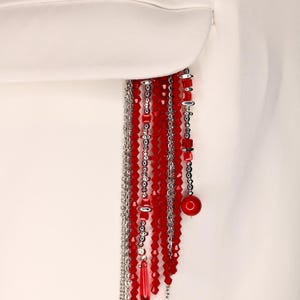 May include: A set of three ceramic mugs with a speckled, matte finish in cream, grey, and black. Each mug has a minimalist design, suitable for coffee or tea. The mugs are stacked on top of each other.