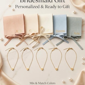 May include: An assortment of personalized bridesmaid gifts. The image features gold heart charm bracelets and matching colored pouches with names like Sofia, Chloe, Mia, Emma, and Aria. The text reads "Bridesmaid Gift, Personalized & Ready to Gift" and "Mix & Match Colors."