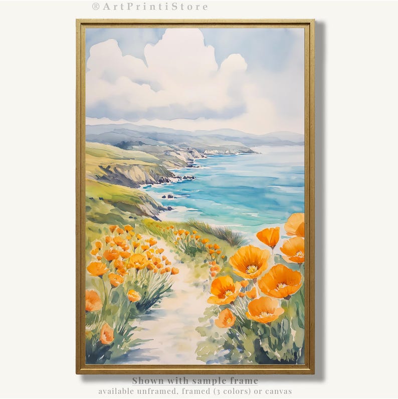 The image is a watercolor painting depicting a scenic coastal landscape with a path leading through a field of vibrant orange flowers. The painting is framed and displayed on a wall, showcasing the artist's skill and attention to detail in capturing the beauty of the natural surroundings.
