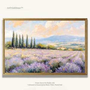 The image is a framed painting depicting a picturesque landscape with a field of lavender flowers, a line of trees, and a distant mountain range under a cloudy sky.