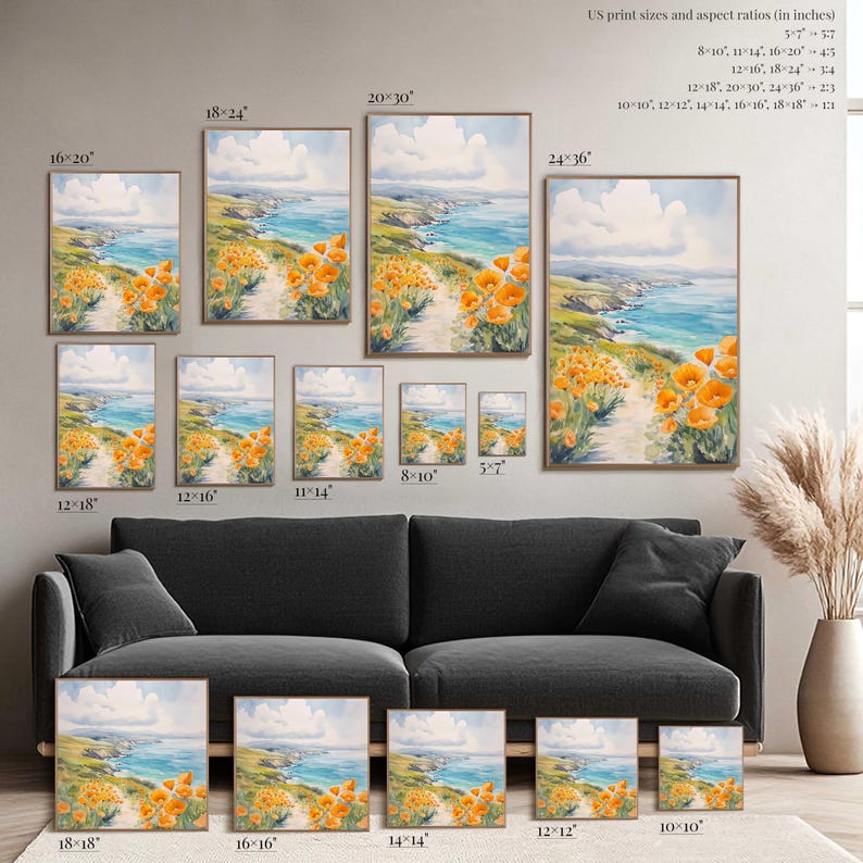 a collection of framed landscape paintings featuring a scenic coastal view with orange flowers. The paintings vary in size, ranging from 12" to 18" and 14" to 16" in inches. The artworks are arranged on a wall, with a black couch in the foreground.