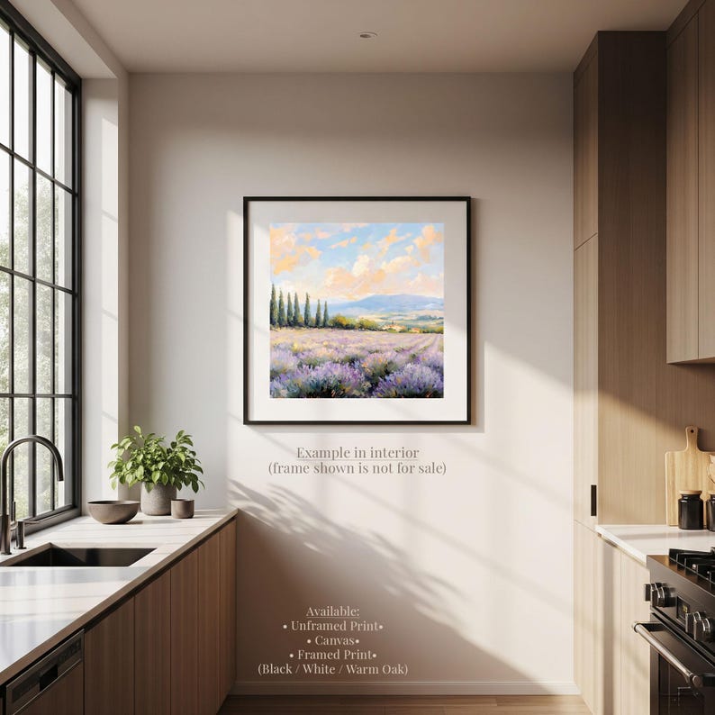 a serene kitchen scene with a framed landscape painting hanging on the wall, featuring a field of lavender flowers and a picturesque countryside landscape.