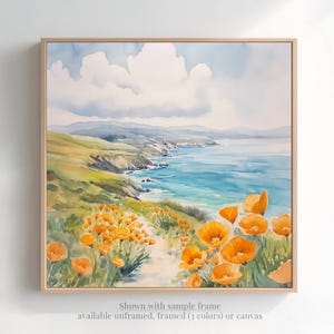 The image is a watercolor painting depicting a scenic coastal landscape with a path leading through a field of vibrant orange flowers. The painting is framed and displayed on a wall, showcasing the artist's skillful use of color and brushstrokes to capture the beauty of the natural surroundings.