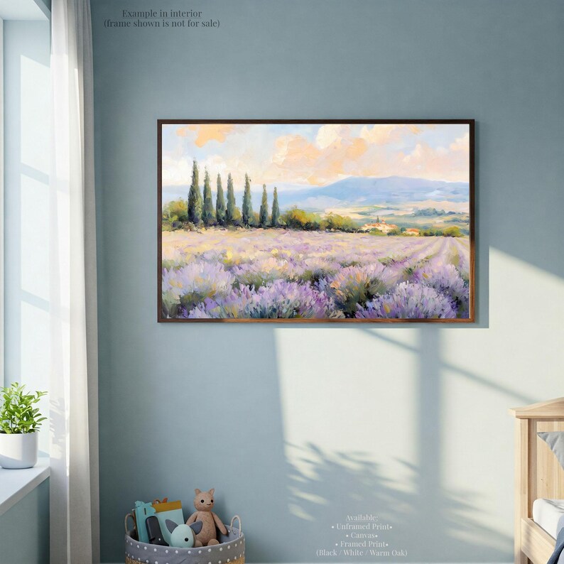 a framed painting of a field of lavender flowers hanging on a wall in a room with a window and a wooden dresser.