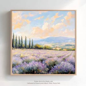 The image is a framed painting depicting a picturesque landscape with a field of lavender flowers, a line of trees, and a distant mountain range under a blue sky with clouds.