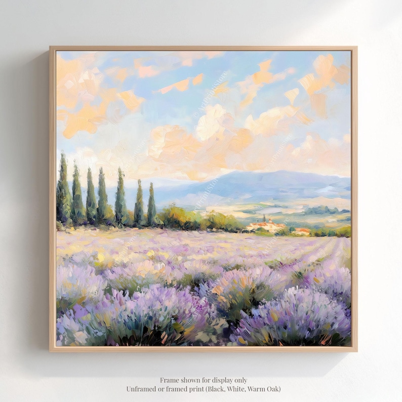 The image is a framed painting depicting a picturesque landscape with a field of lavender flowers, a line of trees, and a distant mountain range under a blue sky with clouds.