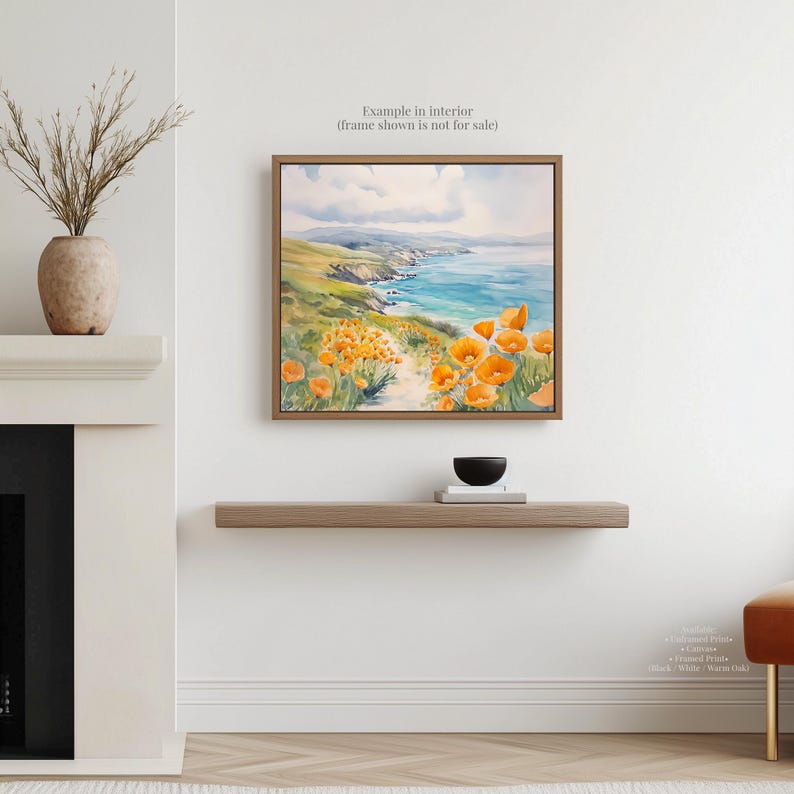 a painting of a coastal landscape with a path leading through a field of orange flowers, hanging on a wall above a wooden shelf.