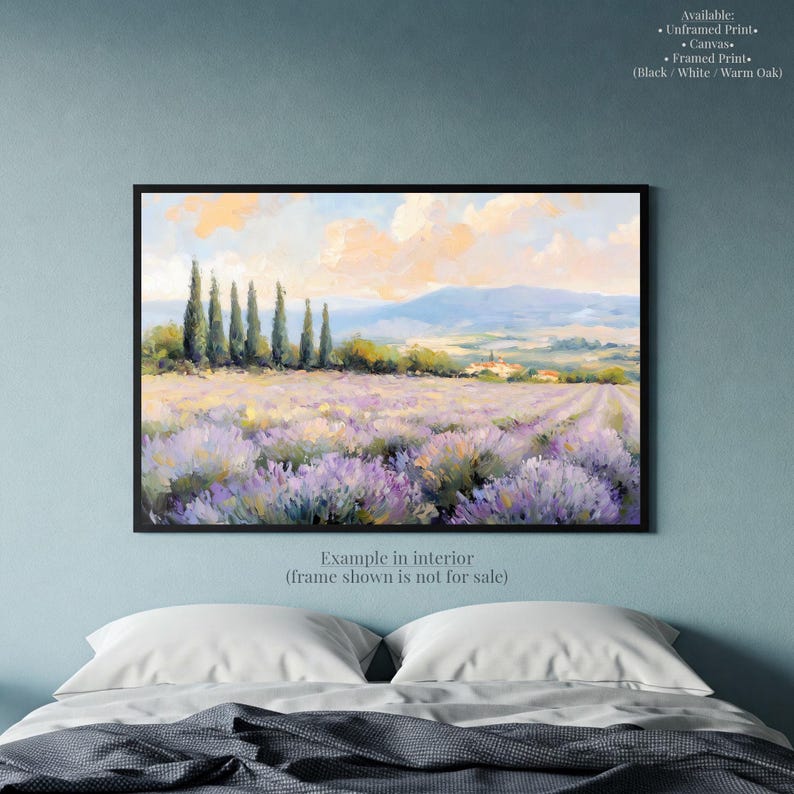 a serene landscape with a field of lavender flowers, a line of trees, and a mountain range in the distance.