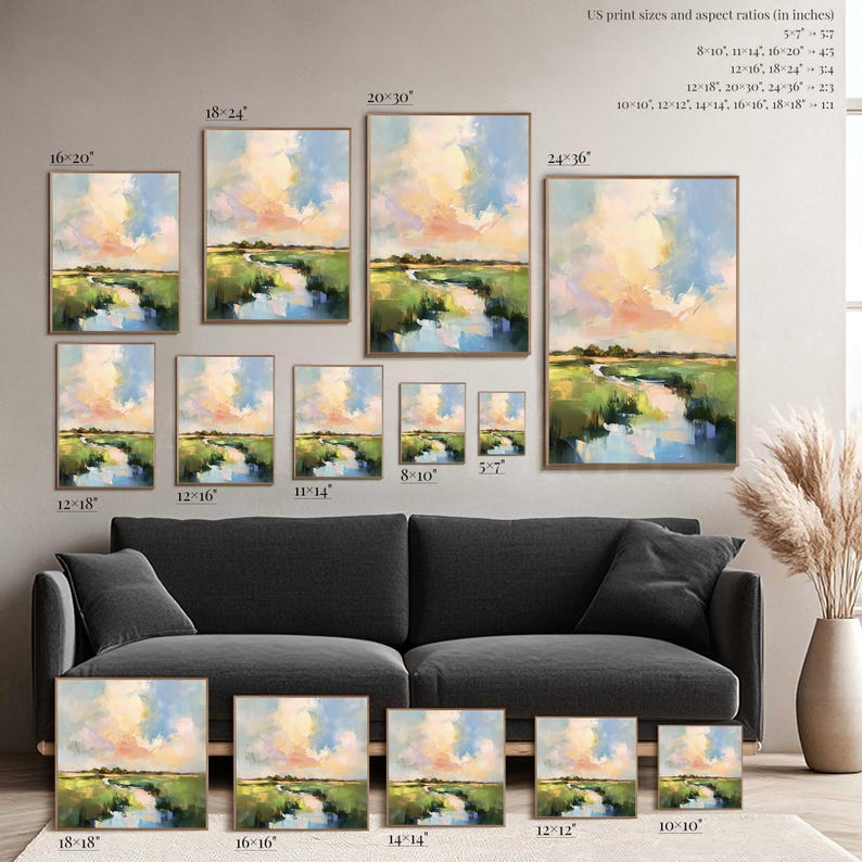 a collection of landscape paintings in various sizes, ranging from 12" to 18" and 14" to 16" in width, arranged on a wall above a gray sofa.