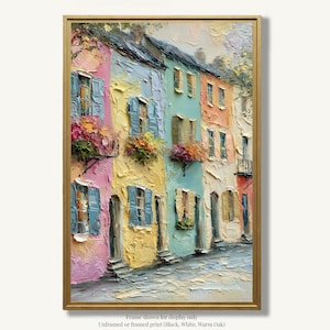 May include: An oil painting on canvas featuring a row of colorful townhouses in pink, yellow, light blue, and orange. The textured impasto technique depicts windows with blue shutters and flower boxes filled with vibrant blooms, all set in a gold frame.
