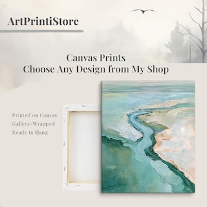 The image is an advertisement for canvas prints, featuring a landscape painting of a winding river and a bird in flight. The text on the image promotes the ability to choose any design from the artist's shop, and it is printed on a canvas with a gallery-wrapped border, ready to hang.